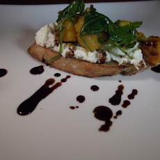 Ricotta crostini with butternut squash, arugula, and balsamic drizzle.