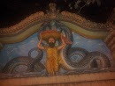 Father Saving Krishna from Snake Sculpture