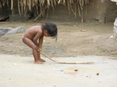 Child, how happy you are sitting in the dust, playing with a broken twig all the morning...
