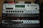 The current studio rack (upgraded June 2008)... Top to bottom: Line 6 Gearbox D.I., Korg Triton rackmount workstation/sampler, (2) Presonus DigiMax FS preamp/ADA converters, (2) ART MDM-8L compressor/limiters