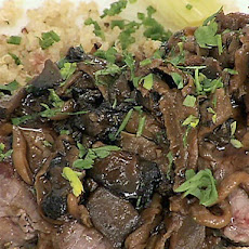 Seared and Carved Beef Tenderloin with Herb Quinoa, Poached Leeks and Wild Mushroom Reduction