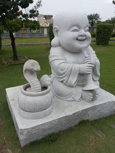 Maitreya with Snake Statue