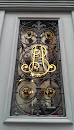 Golden Initials at a Door