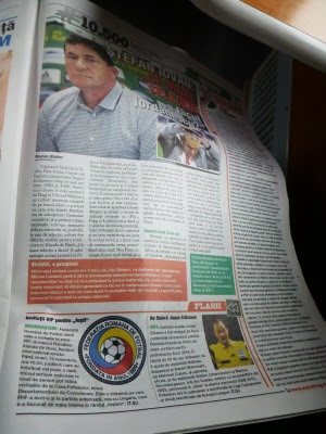 Newspaper with Romania v. Northern Ireland match preview.