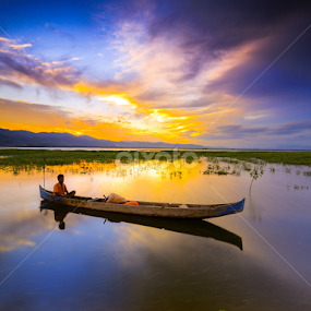 a fishermsn at limonto by Andrial Kusuma - Transportation Boats