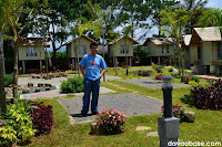 Hubby standing on a camping site and amidst the camp houses in Camp@Tagan Lake Mirror and Hillside