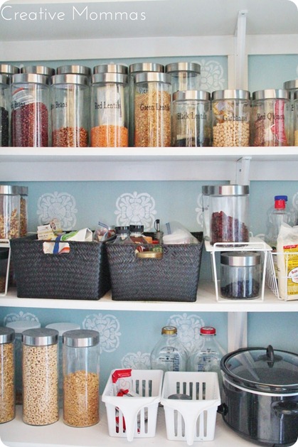 organized pantry with barn door