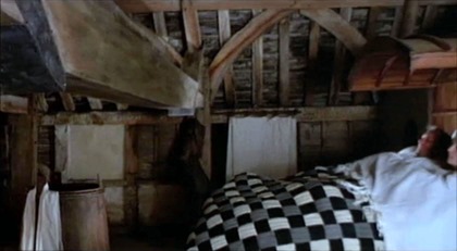 Carpenter John and Alison under a checkered quilt (The Miller's Tale)