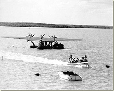 A Dutch crew from a visiting Dornier Do 24 flying boat in Roebuck Bay being taken into Broome by launch