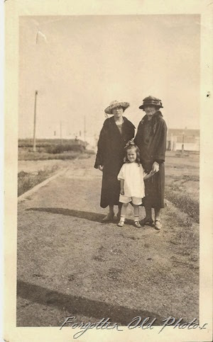 Ladies in hats and little girl with no coat Moorhead Ant