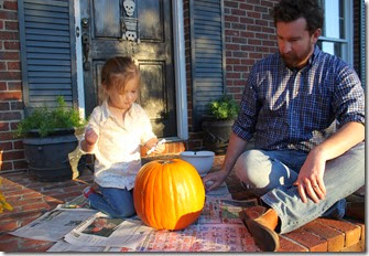 Zoey & Daddy carving pumpkin