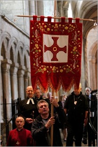 John Cuthbert carries the Banner through the Cathedral south quire  aisle