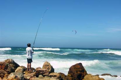 Fishing at the ocean shore