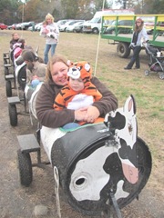 10.29.11 Cousins halloween get together Julie and Graham riding in Moo Linda the cow