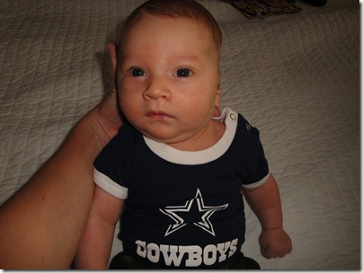 6.  Knox sitting up in cowboys gear
