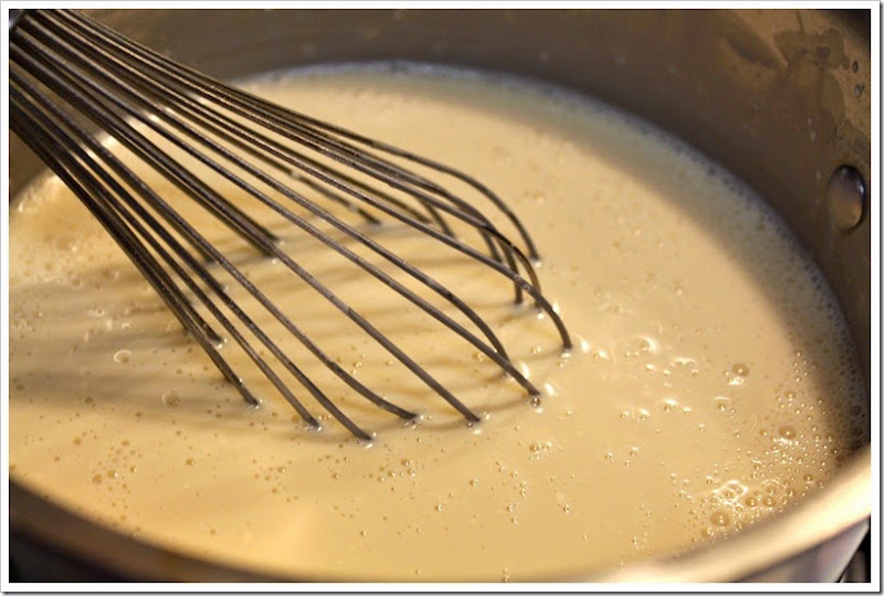 Mixing the three kinds of milk for the sponge cake. 
