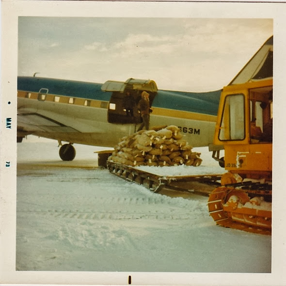 Loading C-46 w-tractor & sled_1973
