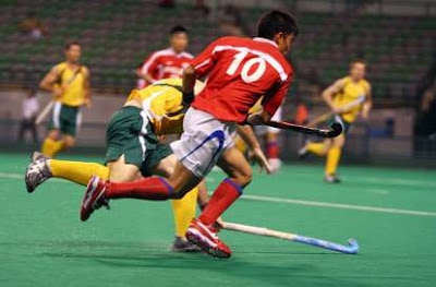 Playing field hockey