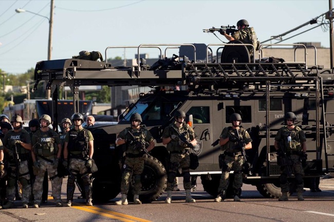 CC Photo Google Image Search Source is pbs twimg com  Subject is militarized police