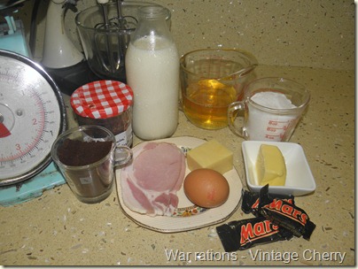 A week of rations, WWII, coffee, jam, milk, oil, sugar, butter, chocolate, egg, cheese and bacon.