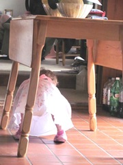 Easter Sunday Bella crawling under table 2012