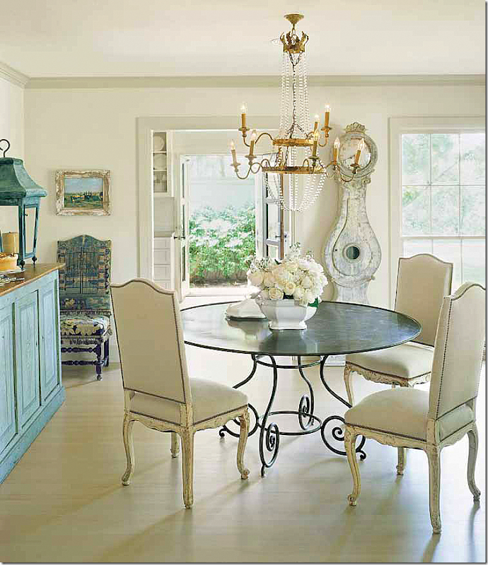 Dining room with Swedish style, Mora clock, and round table - Jane Moore. Veranda, March 2008. Found on Hello Lovely Studio.