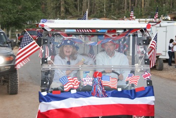 grandma and papa driving mule in parade (1 of 1)