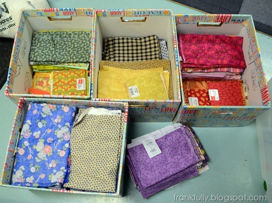 fabric sorted by color into bankers boxes