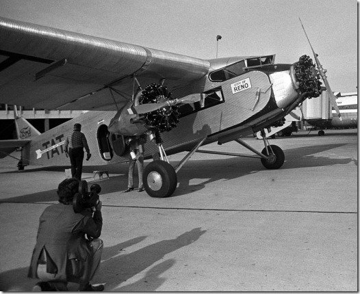 A Ford Tri-Motor in the livery of Transcontinental Air Transport, the forerunner of Trans World Airlines, as it would have appeared at the inauguration of TWA's transcontinental passenger service in 1929. This aircraft toured the U.S. for the 45th anniversary of TWA's transcontinental service in 1974. The plane is now housed at the McMinnville, Ore., airport and flies at airshows. This photo was made at Weir Cook (now Indianapolis International) Airport. <br />