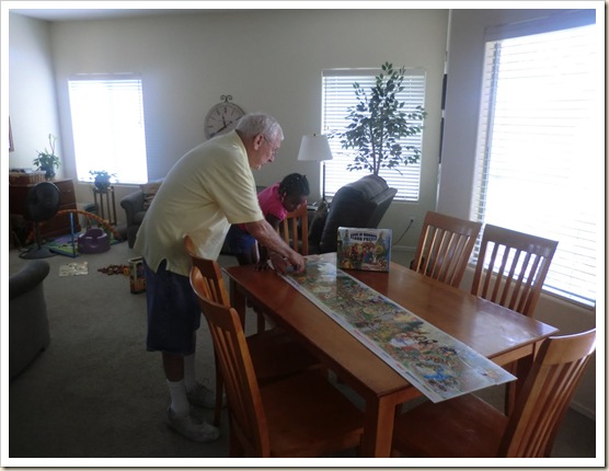8-22-11 Grandad and Bailey doing puzzle on table