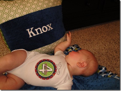 23.  Knox playing with pillow