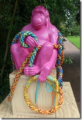 pink ape with rope