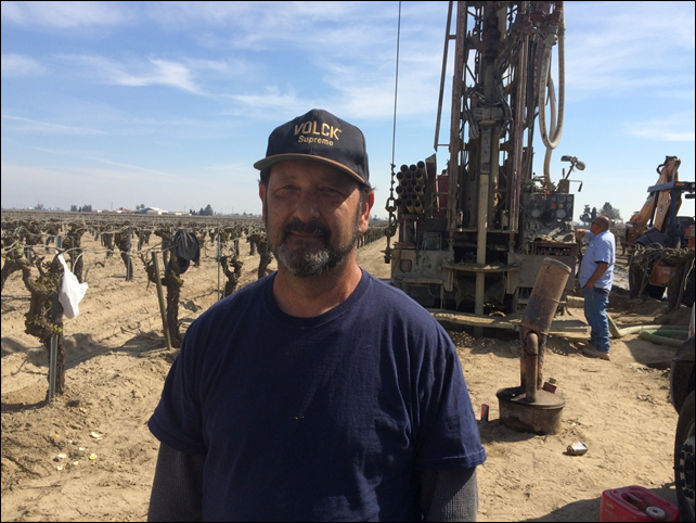 Clarence Freitas, 56, who owns 70 acres of almonds and grapes, watches with relief as a team from Arthur & Orum drilled into his baked soil, boring through 80ft a day until reaching 440ft and an expensive, urgent replacement for his old 160ft-deep well. Photo: Rory Carroll for the Guardian