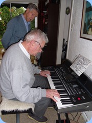 Alan Wilkins had a go on Gordon's Korg Pa3X with Michael Bramley watching on with interest.
