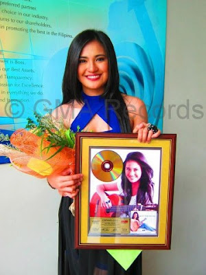 Julie Anne San Jose with her gold record award