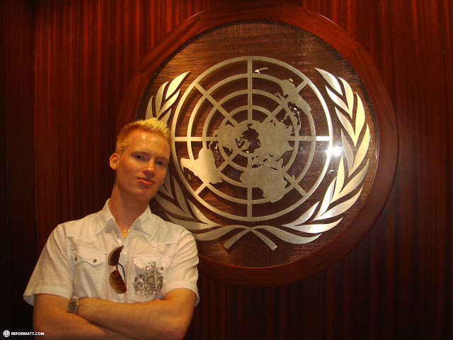 in front of the United Nations symbol in New York City in New York City, United States 