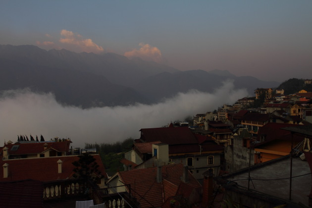 Sunrise over the clouds, mountains and Sapa town of Vietnam