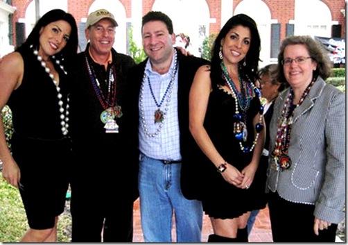 In this Jan. 30, 2010 photo, Natalie Khawam, left, Gen. David Petraeus, Scott and Jill Kelley, and Holly Petraeus watch the Gasparilla parade from the comfort of a tent on the Kelley's front lawn in Tampa, Fla. Jill Kelley is identified as the woman who received threatening emails from Gen. David Petraeus' paramour, Paula Broadwell. Jill Kelley serves as the State Department's liaison to the military's Joint Special Operations Command. (AP Photo/The Tampa Bay Times, Amu Scherzer) TAMPA OUT; CITRUS COUNTY OUT; PORT CHARLOTTE OUT; BROOKSVILLE HERNANDO TODAY OUT; USA TODAY OUT; TV OUT; NO WEB USE; MAGS OUT