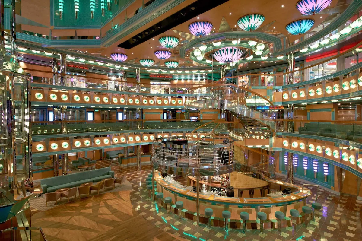 Carnival-Magic-Atrium-Magic-Bar - The Magic Bar, on deck 3 of Carnival Magic's atrium, is a perfect spot to meet friends for cocktails and people watching. 