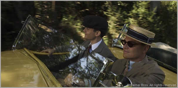 Nick Carraway (Tobey Maguire, L) and Jay Gatsby (Leonardo DiCaprio) out for a wild spin. CLICK to visit the official site for THE GREAT GATSBY movie.