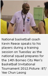 National basketball coach Kevin Reece speaks to his players during a training session on Tuesday as the national squad prepares for the 14th Borneo City Men's Basketball Invitational Tournament 2012.Picture: BT/ Yee Chun Leong 