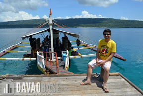 Hubby sitting at the boat dock while waiting for the Scubasurero divers to arrive