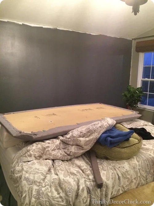 dark accent wall behind bed