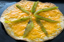 return tortilla to oven and toast for 2 more minutes