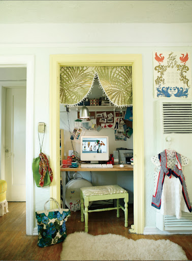 I really like the idea of tucking a small office into a closet.  It's such a space saver.  The bright yellow trim and vintage fabric are fun touches.