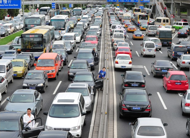 Drivers check for a better view during 'Car Free Day' in Beijing. Frederic J. Brown / AFP / Getty Images
