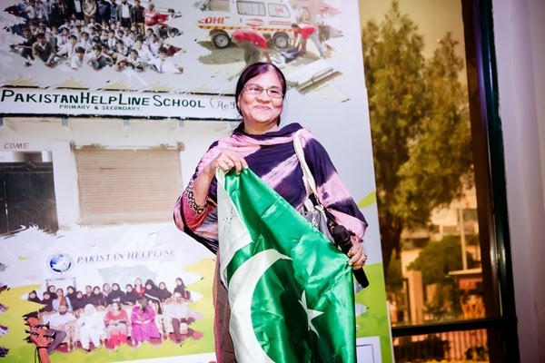 Mam Farzana holding flag