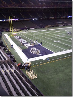 Superdome end zone being painted purple