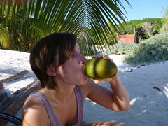 Drinking coconut milk on the beach in Tulum