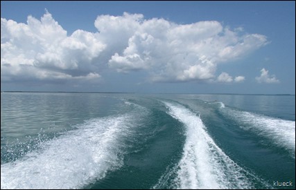 clouds in wake from boat